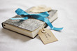 close up of book tied with ribbon and gift tag
