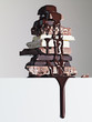 chocolate syrup dripping over stack of chocolate bars