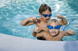Photo: Summer fun, boys playing in swimming pool Summer fun, boys playing in swimming pool
