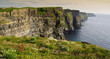 sunset over famous cliffs of moher county clare, ireland