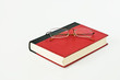 Glasses on red book