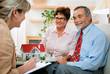 Couple discussing  with real estate agent or architect