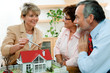 Couple discussing  with real estate agent or architect