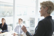 businesswoman taking notes in meeting
