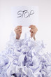 Businessman overwhelmed by the paper