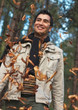 Young happy men walk in park, autumn day