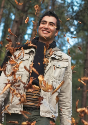 Photo: Young happy men walk in park, autumn day Young happy men walk in park, autumn day