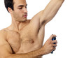 Foto: Young Man Applying Deodorant. Model Released Young Man Applying Deodorant. Model Released