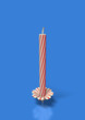 Unlit red stripes candle