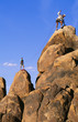 Photo: Rock climbing team reaching the summit. Rock climbing team reaching the summit.