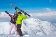 Young happy couple in winter mountains