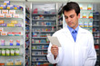Photo: pharmacist reading prescription at pharmacy pharmacist reading prescription at pharmacy