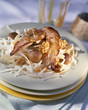 Sliced duck breast with white cabbage and walnuts