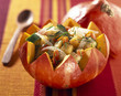 Pumpkin salad served in half a pumpkin