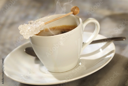 Photo: sugar stick placed on coffee cup sugar stick placed on coffee cup