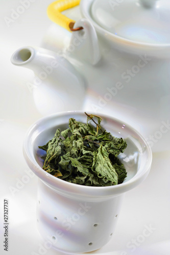 Photo: Loose tea in sieve and teapot Loose tea in sieve and teapot