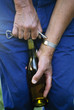uncorking bottle of rosé