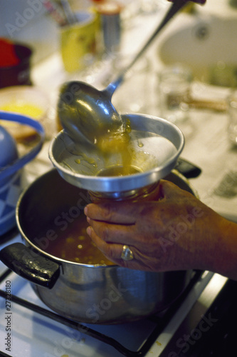 Photo: filling jar with jam filling jar with jam