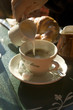Adding milk to a cup of coffee
