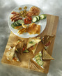 Spreading the different garnishes on the sandwich bread
