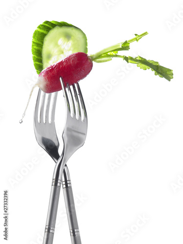 Photo: Two forks with radish and cucumber ;light lunch Two forks with radish and cucumber ;light lunch