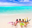 Kids on beach with dive gear