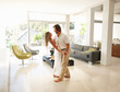Loving mature couple dancing in a modern living room Loving mature couple dancing in a modern living room