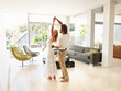 Romantic mature couple dancing in a modern living room Romantic mature couple dancing in a modern living room