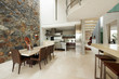 Modern interior with dining room and stone wall Modern interior with dining room and stone wall