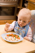 baby eating lunch