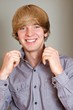 Smiling man holding his collar