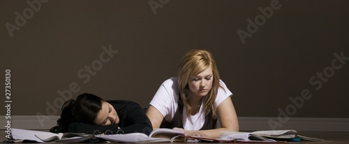 Photo: Two Women Studying And Sleeping Two Women Studying And Sleeping