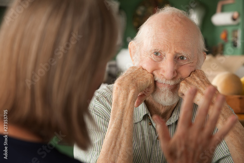 Photo: Senior couple at home focusing on angry man Senior couple at home focusing on angry man