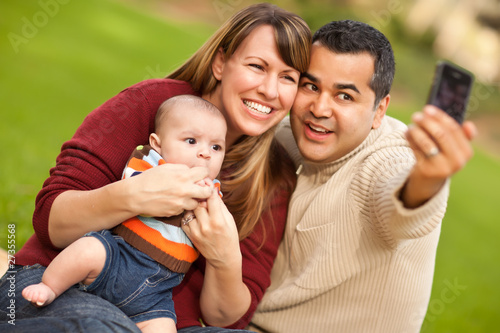 Photo: Happy Mixed Race Parents and Baby Boy Taking Self Portraits Happy Mixed Race Parents and Baby Boy Taking Self Portraits