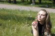 girl blowing soap bubbles lying on green grass dandelions girl blowing soap bubbles lying on green grass dandelions