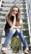 Pretty Lovely brunette girl sitting on the stairs Pretty Lovely brunette girl sitting on the stairs
