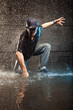 Cool looking hip-hop dancer in aqua studio