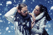 Handsome couple in winter snow