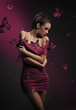 Image : Conceptual image of young brunette beauty and violet butterflies