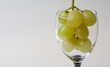 glass with white grapes glass with white grapes