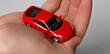 red car in the man's hands red car in the man's hands
