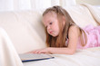 Little girl lying on the couch Little girl lying on the couch