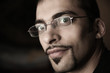 Handsome cool man in glasses portrait, closeup on face.