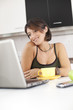 Modern woman reading e-mails at her breakfast
