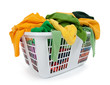 Bright clothes in laundry basket. Green, yellow. Bright clothes in laundry basket. Green, yellow.