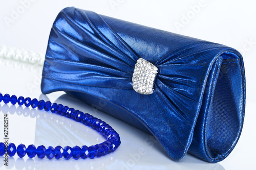 Photo: Ladies' handbag and beads Ladies' handbag and beads