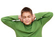Teenage boy with arms on ears