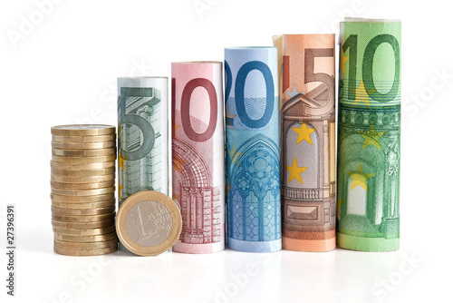 Foto: euro rolled bills and coin - euro monete e banconote euro rolled bills and coin - euro monete e banconote