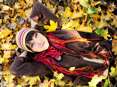 Photo: Girl in autumn leaves. Girl in autumn leaves.