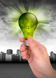Hand Holding Green Energy Light Bulb Hand Holding Green Energy Light Bulb